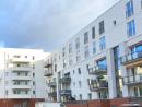 In the foreground the extension of Stefan-Zweig-Straße 8-12 with the new raised terrace areas as a clear separation from the public space and in the background House I with student housing, © City Planning Office City of Frankfurt am Main 